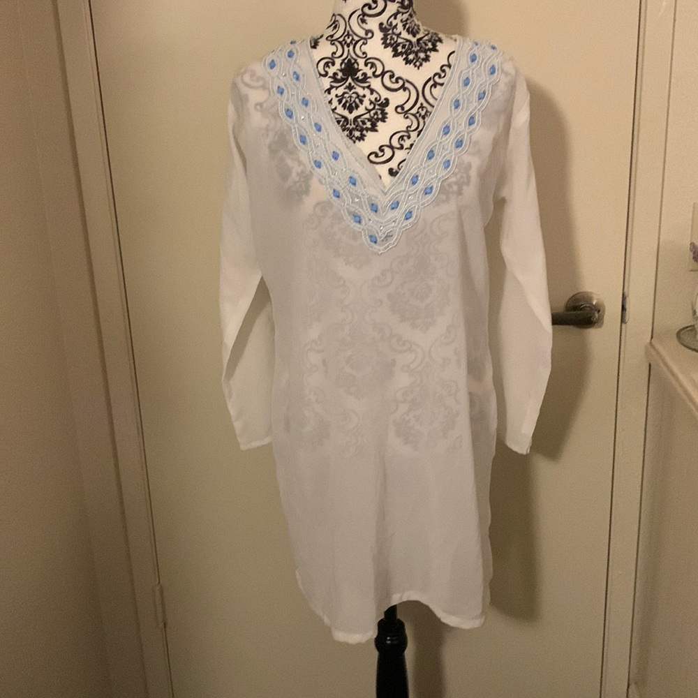 White cover up with  blue sequins